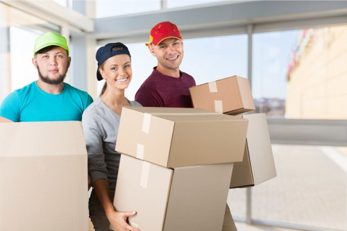 Removal team handling boxes safely during a house move