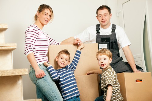 Removal van and moving crew in a Barnes residential street