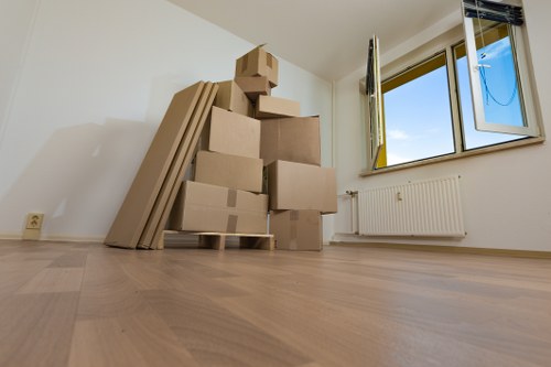 Local movers preparing a Barnes home move with boxes and furniture
