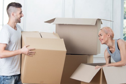 Packed moving boxes and furniture prepared for house removals in Barnes
