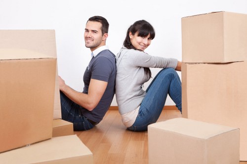 Professional movers loading household items for a Barnes home relocation