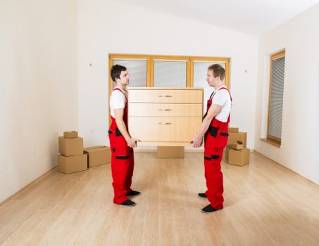 Careful moving of furniture in a Barnes property with narrow access